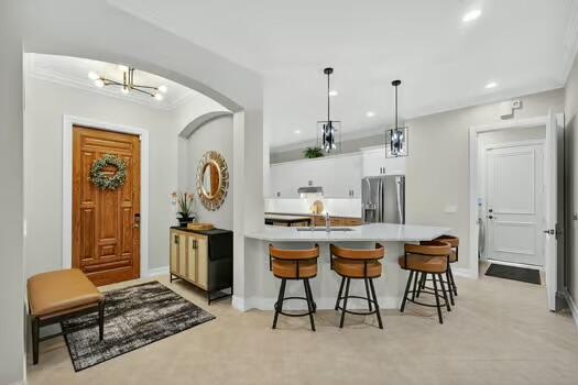 Spectacular RENOVATED- SINGLE STORY plan featuring a most welcoming open layout that accommodates up to 7 guests w/ full membership privileges in the highly sought after community of Frenchman's Reserve Country Club. Enjoy recent enhancements such as hardwood flooring, custom window treatments &new lighting fixtures throughout, never used brand new gleaming quartz countertops w/ seating for 4, island w/ addt'l seating, updated cabinetry, new induction cooktop & 2 addt'l refrigerators, remodeled bathrooms w/ new quartz counters, new porcelain floors & shower walls, formal dining dining area, an accommodating primary suite w/ walk-in closets & relaxing soaking tub, a spacious patio w/ seating for 8 w/ grill & much more. Convenient to all that is synonymous w/ the Palm Beach lifestyle.