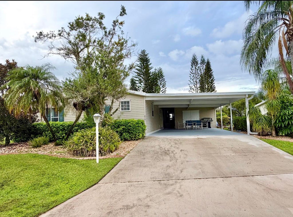 Photo of 8110 9th Hole Drive, Port Saint Lucie, FL 34952 (MLS # B26077229)