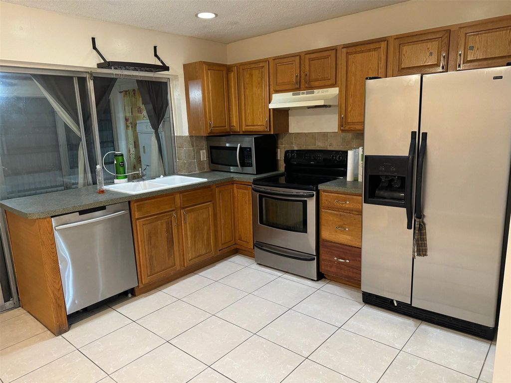 Photo of 4564 NW 16th Avenue, Tamarac, FL 33309 (MLS # B26016732)
