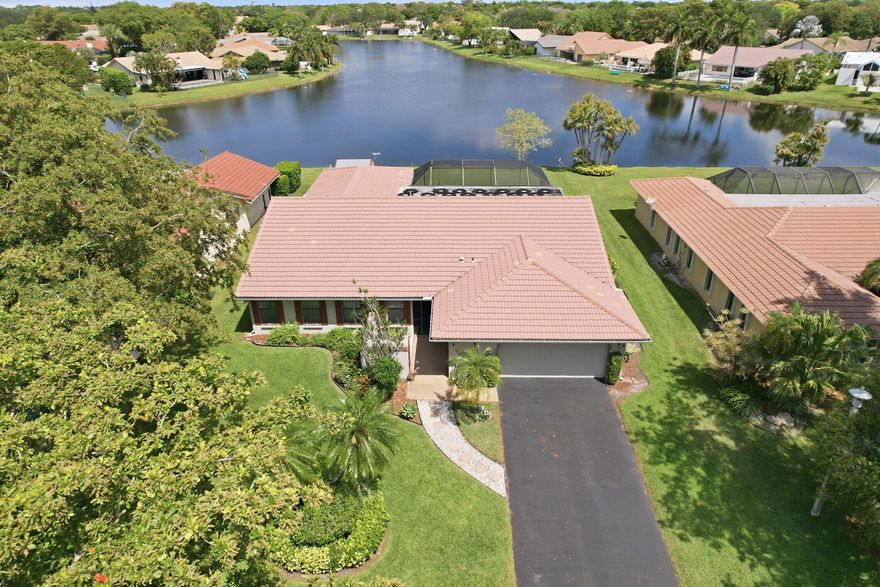 Pack your bags—this expanded Patrician model in highly sought after Cypress Run may be the last move you'll ever want to make. Stunning 4/2 waterfront home with over 500 ft of serene water views. Features include a new 2023 A/C, gorgeous open kitchen with granite, split floor plan, 2 and a half car garage, and a permitted storage shed for exceptional extra space. Enjoy top rated Coral Springs schools and peaceful living in a prime location.