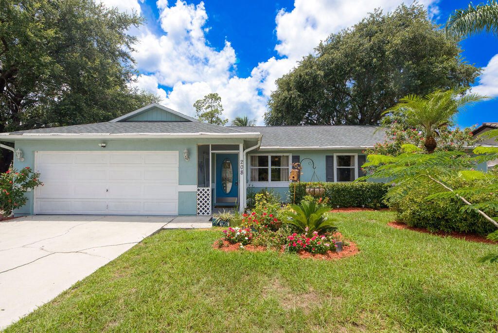 Photo of 208 SE Sims Circle, Port Saint Lucie, FL 34984 (MLS # R11098857)