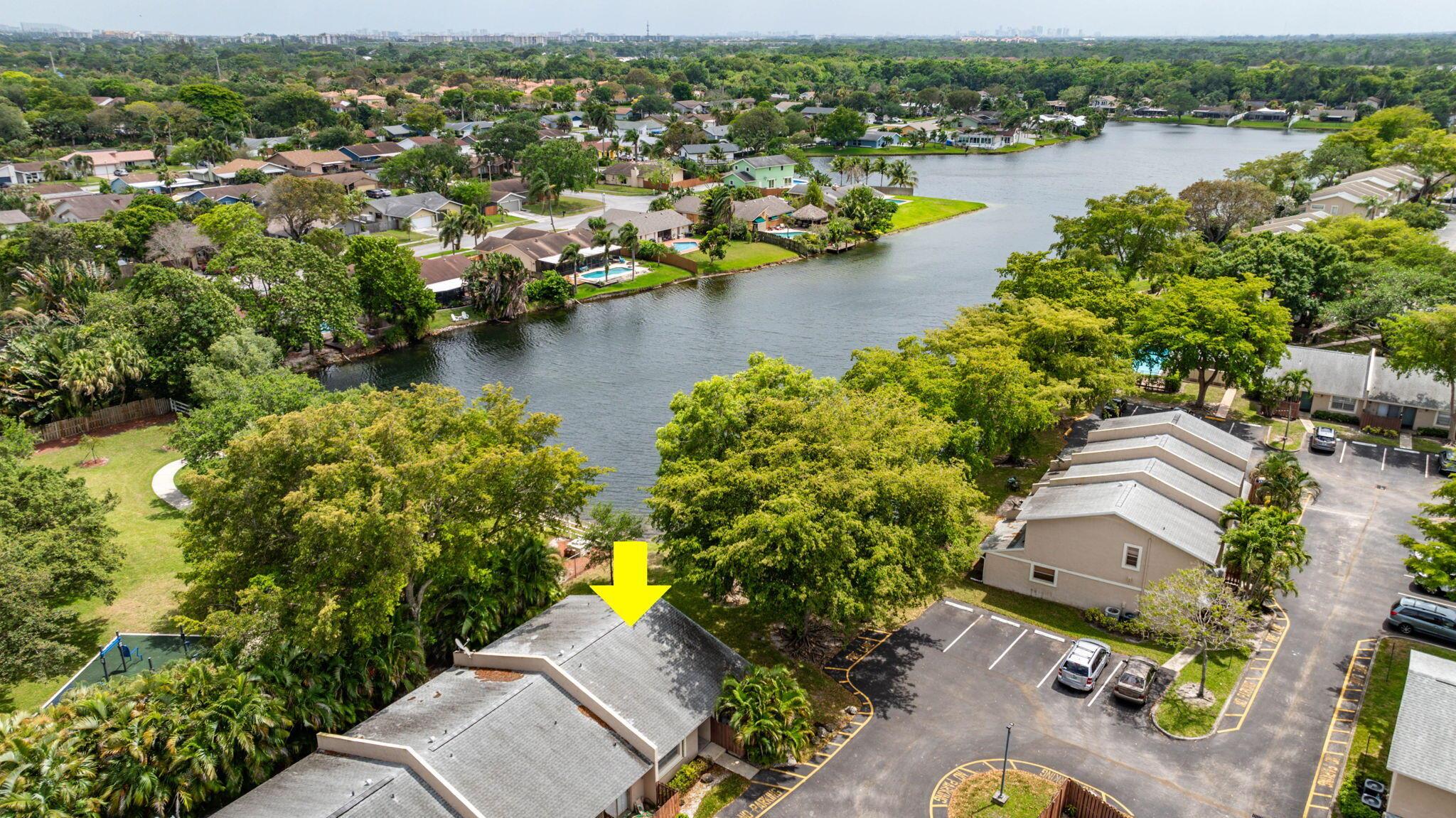 Welcome to Woodlake Villas in Coconut Creek!Introducing a stunning and meticulously updated 2-bedroom, 2-bathroom end unit villa that embodies the perfect blend of comfort, style, and tranquility. Nestled in the serene surroundings of Woodlake Villas, this home offers breathtaking waterfront views complemented by an expansive oversized side yard, making it a rare find in the community.Peaceful Retreat & Prime LocationSituated furthest from the road, this villa promises an added layer of quietness and privacy, allowing you to enjoy peaceful mornings and tranquil evenings. Step out onto the amazing screened-in back porch and be greeted by mesmerizing vistas of a beautiful city park, creating a seamless blend of nature and urban living right at your