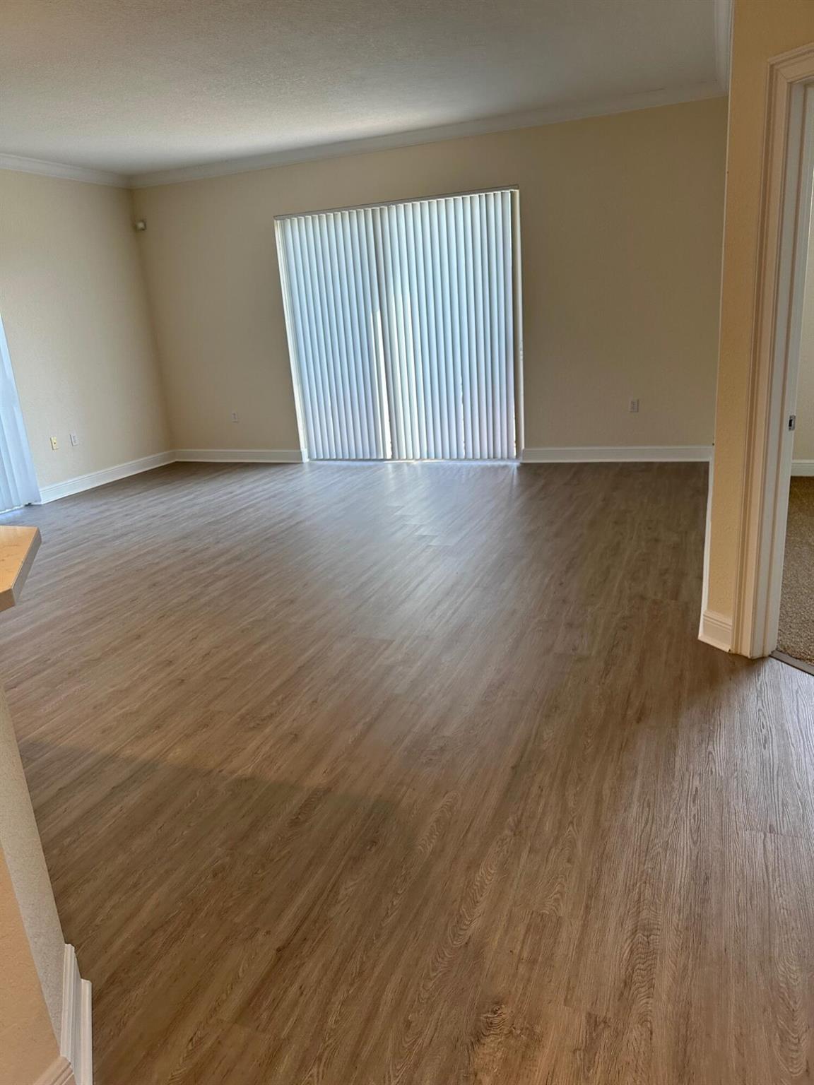 Bright and Spacious, NON-SMOKING apartment with volume ceilings, crown molding, walk-in closet, washer/dryer. Great location between I-95 and Florida's Turnpike. Walk to dining and shopping.SPECIAL: 13th month free with 12-month Lease.$300 Administrative fee required.