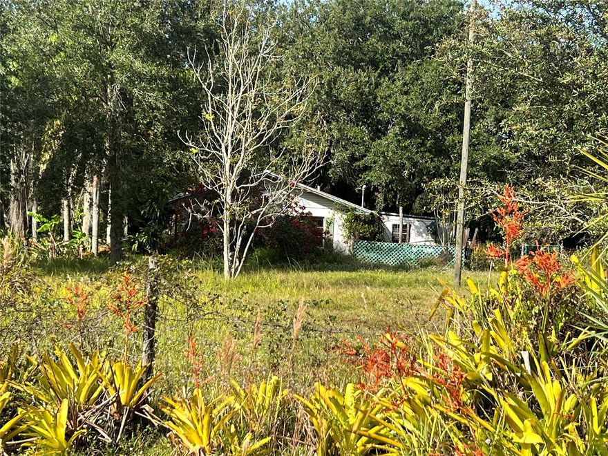 Nestled on a beautiful 1.25-acre lot, this classic CBS home sits quietly beneath a canopy of majestic Old Florida oak trees. The home itself needs a some TLC, but its solid CBS bones make it the perfect canvas for someone with vision. With a bit of care, this property could become a true Old Florida retreat — where you can sip coffee under the oaks, or by the pond, and enjoy the peace and quiet of your own slice of natural paradise.