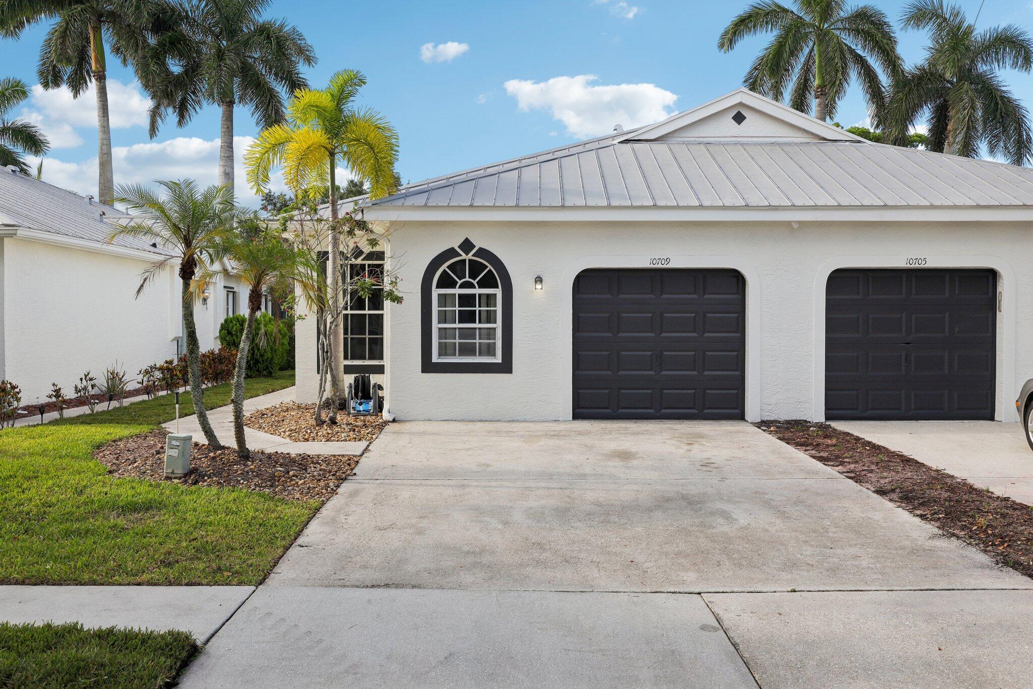This charming villa in the sought-after Pelican Key Subdivision of Wellington's Edge is nestled in the heart of Wellington with easy access to everything, including A-rated schools. Enjoy the convenience of being within walking distance to the mall and top restaurants, and just a short drive to the world-renowned equestrian community.The home features a freshly painted interior and exterior, a 2-bedroom, 2-bath split floor plan, vaulted ceilings, and a pass-through kitchen that creates an open, airy feel. Relax on your serene patio oasis surrounded by lush greenery.Wellington's Edge offers resort-style amenities, the peace of mind of a gated community, and miles of beautiful walking and nature paths. This villa truly combines comfort, location, and lifestyle