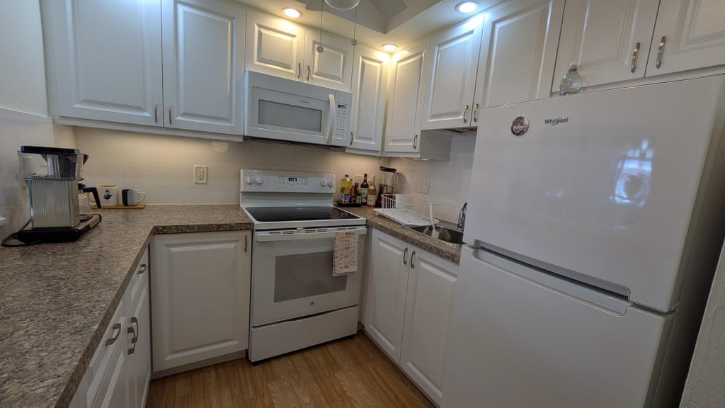 Photo of 2880 LAKE OSBORNE Drive #109, Lake Worth Beach, FL 33461 (MLS # B26092580)