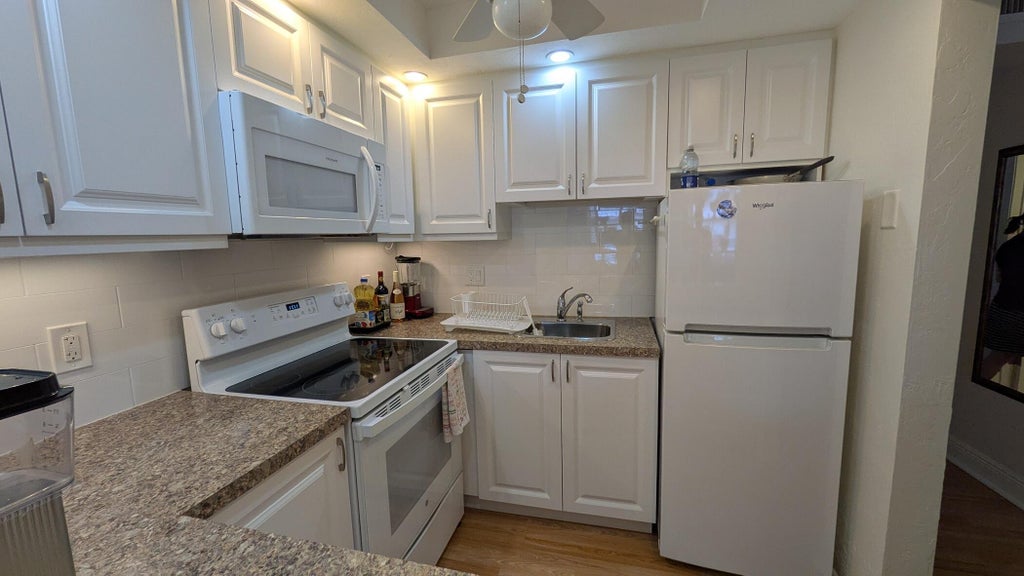 Photo of 2880 LAKE OSBORNE Drive #109, Lake Worth Beach, FL 33461 (MLS # B26092580)