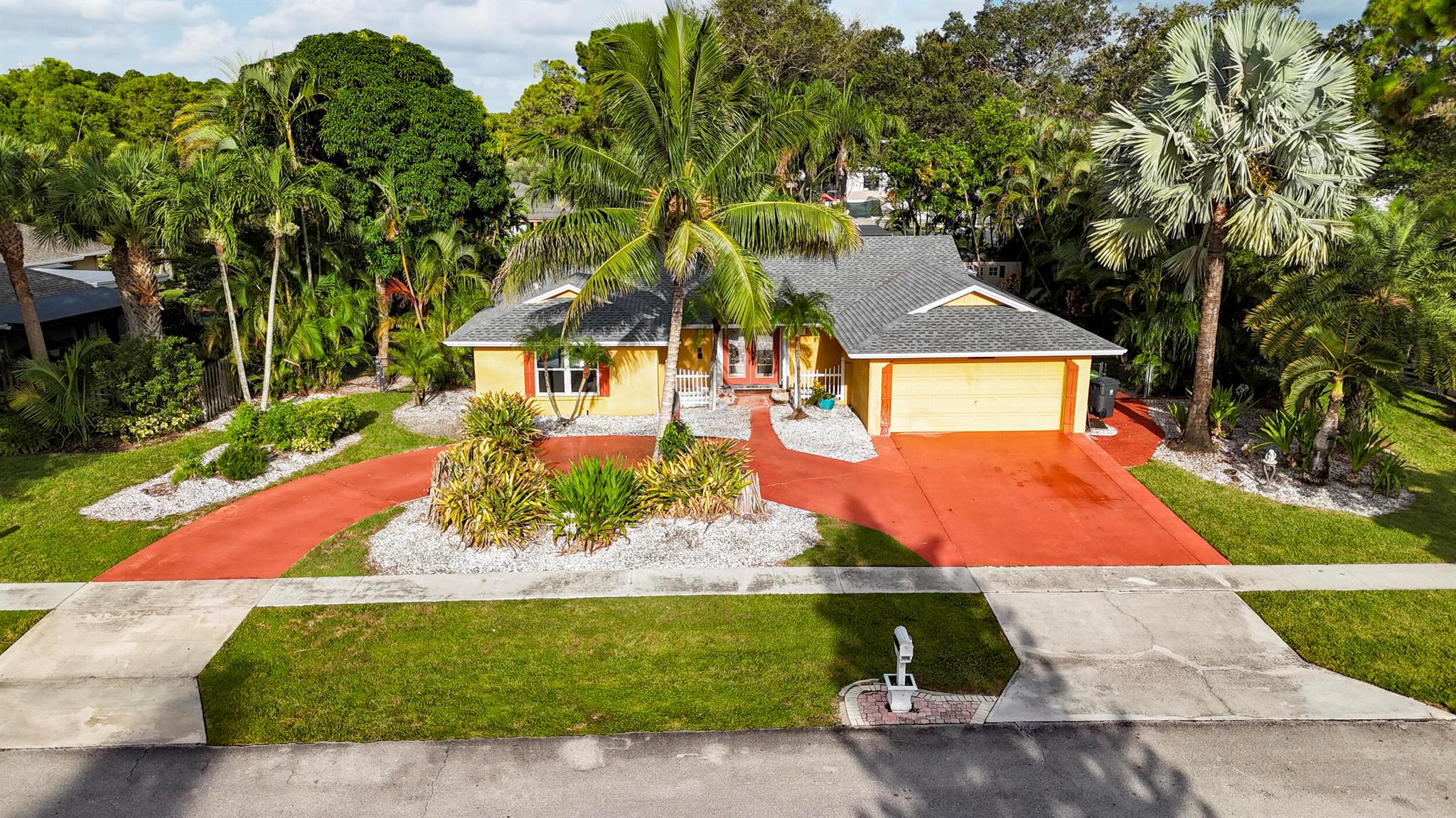 This Wellington Gem located in Pinewood Manor features 2,024 sq. ft. of living space on a generous .33-acre lot.At the heart of this home is a stunning 8 ft. x 5 ft. kitchen island, a true showstopper and perfect gathering space for cooking, entertaining, or simply enjoying the day-to-day! The open floor plan flows seamlessly, making the kitchen the centerpiece of it all.Step outside to your private backyard retreat featuring a heated saltwater pool with an expansive covered patio, screen enclosure over the pool and plenty of space to enjoy Florida living at its best. A circular driveway leads to a spacious 2-car garage, adding both style and function to the exterior of the home. Recent upgrades include a brand-new roof and water heater, giving you peace of mind.