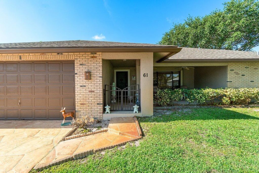 Photo of 61 W Rubber Tree Drive, Lake Worth, FL 33467 (MLS # R11100242)