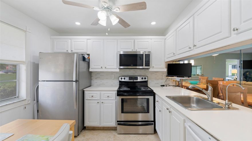 Beautiful Water View with Enclosed Patio under air. Spa Shower surround like new. Ease into your day with your own dressing room. Ceiling fans, new toilets, hot water tank. Great Lokation across from Clubhouse. 75 Clubs-18 hole Executive golf course. Pickleball, zumba, billiards, Restaurant, Doctor, Fitness classes, pools, library, computer center, and community rooms.  Call or Text for showing.