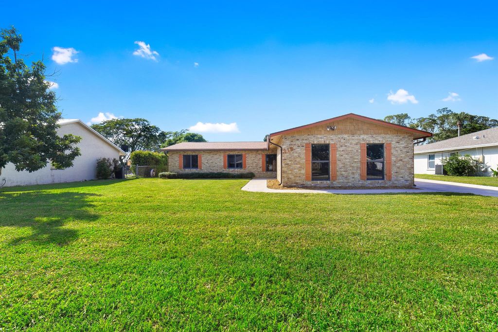 Photo of 215 Sandpiper Avenue, Royal Palm Beach, FL 33411 (MLS # R11138800)