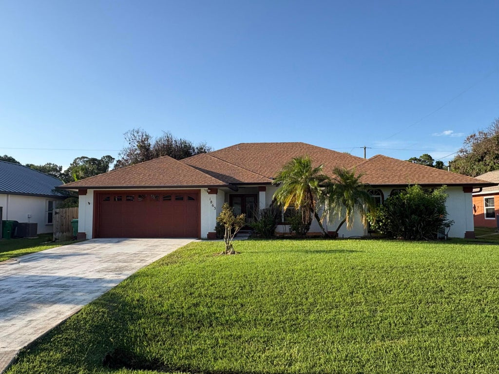 Photo of 1863 SW Janette Avenue, Port Saint Lucie, FL 34953 (MLS # B26067153)