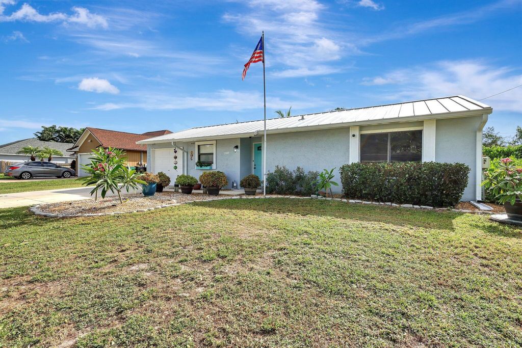 Photo of 2449 SW Cooper Lane, Port Saint Lucie, FL 34984 (MLS # R11004819)