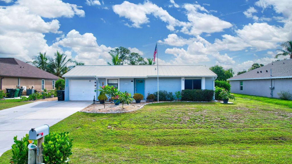 Photo of 2449 SW Cooper Lane, Port Saint Lucie, FL 34984 (MLS # R11004819)