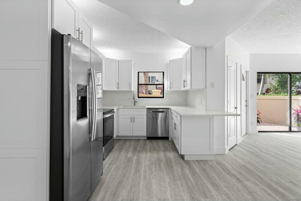 Photo of 82 Uno Lago Drive, Juno Beach, FL 33408 (MLS # R11123953)