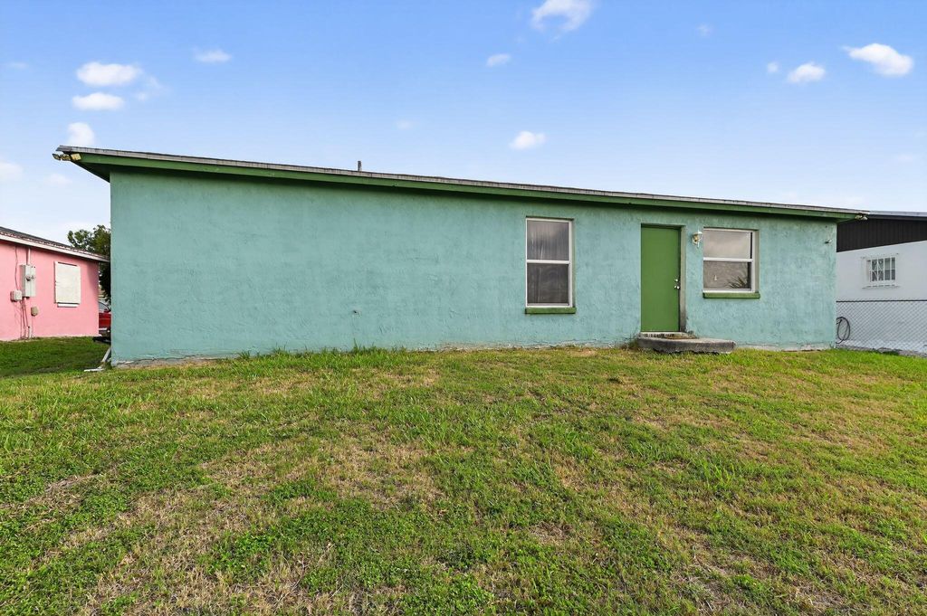 Photo of 1582 Reverend Jesse Biggs Boulevard, Pahokee, FL 33476 (MLS # B26011604)