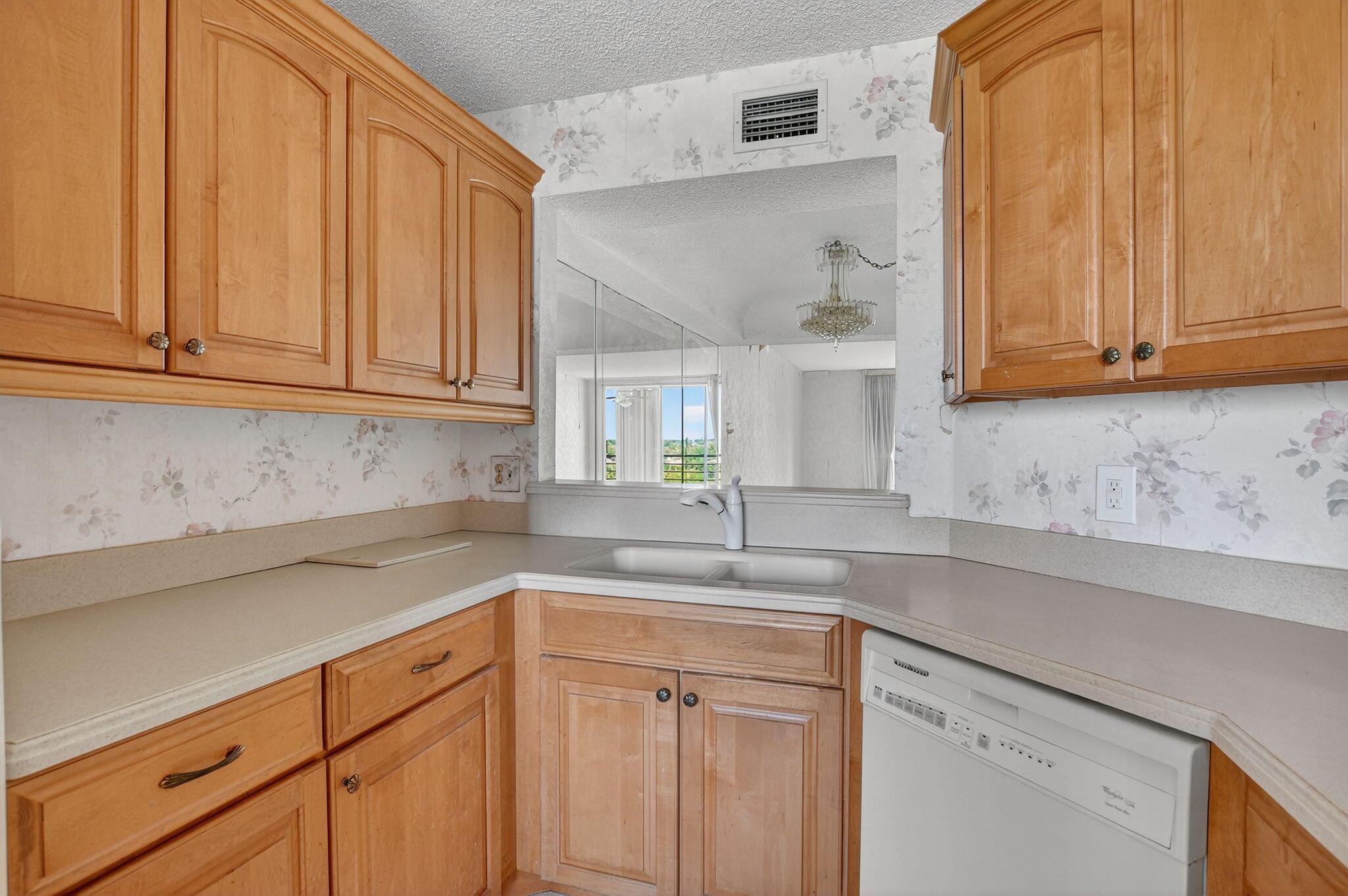 2/2 4th floor unit, skylights in the bathroom, great views. This association has their Engineering and SRS study completed. Great building. This unit needs remodeling and is livable. Great building for an investor flip or owner remodel. New Elevator. Complex is beautifully landscaped and a covered parking space comes with the unit. Heated pool, Tennis and pickleball courts, club house has pool table, card table, library and a meeting room for residents. Active Women's club. Basic cable and HBO, monthly pest control.