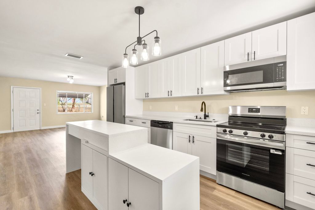 Photo of 2105 Donald Ave, Fort Pierce, FL 34946 (MLS # B26001015)