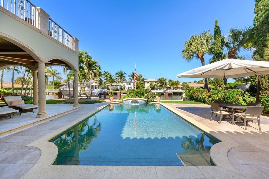 Pristine, custom-built, spacious 4 bedroom, 5 full baths and 1 partial, 2 car garage water front income producing smart home located in Lake Worth, Florida.  Located on a beautiful canal two homes in from the intracoastal waterway with ocean access. Built to code in 2005 with CBC Block all reinforced with cement, high impact windows and French doors, security system, custom wood finishings and Plantation shutters throughout. There is a generator that will run the whole house if you ever lose power. The grand front entrance and bottom level include all marble floors that lead through a grand gallery hall. There is a half bath powder room and two large ensuite bedrooms with cherry hardwood floors and beautiful tiled baths.