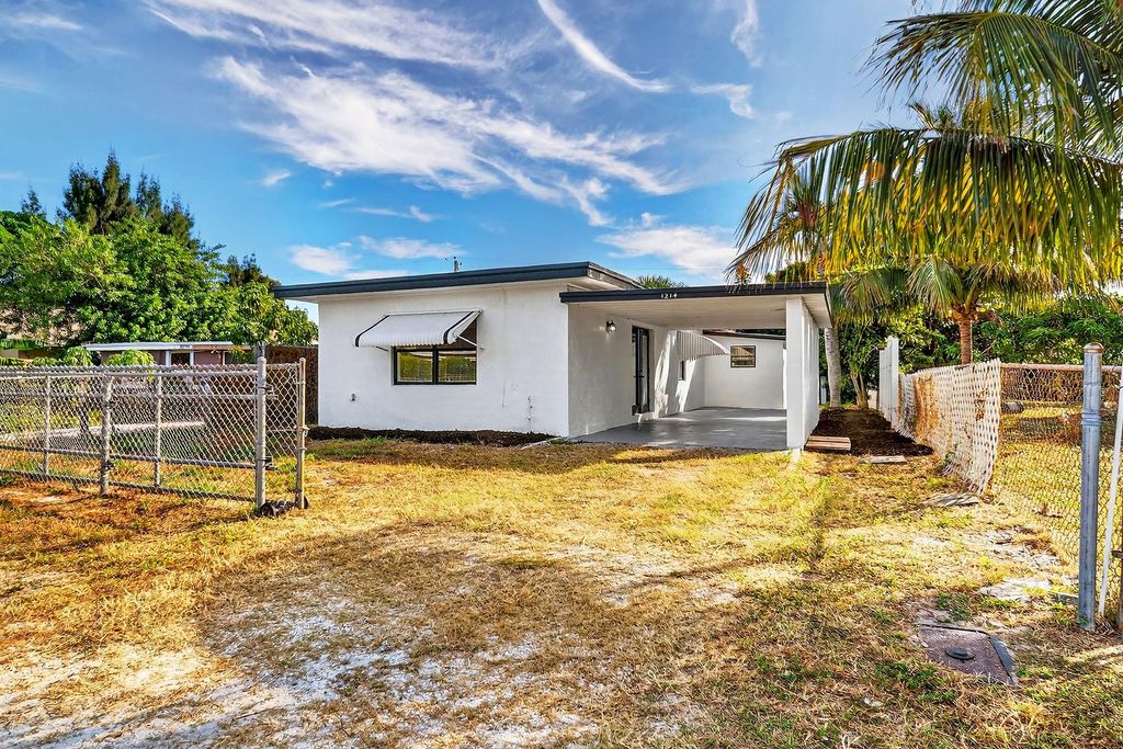 Photo of 1214 Peak Rd, Lantana, FL 33462 (MLS # F10539139)