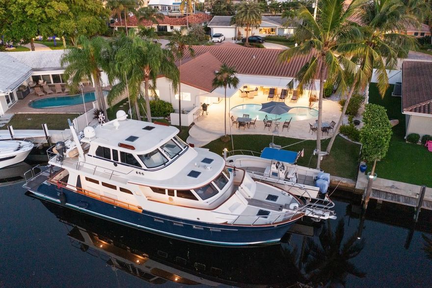 82 FT DEEPWATER | PHOTO SHOWS 70' YACHT WITH 18' BEAM & 5' DRAFT | CANAL WIDTH APPROX 90 FT | 25 FT BOAT LIFT | ROOF APPROX 10-YEARS OLD | IMPACT WINDOWS & EXTERIOR DOORS | GAS INSTANT HOT WATER HEATER | GAS POOL HEATER | LED INTERIOR LIGHTING THROUGHOUT | SONOS MUSIC | CLOSED CELL SPRAY FOAM INSULATION IN ATTIC | BATHS RENOVATED | PLANTATION SHUTTER STYLE WINDOW TREATMENTS | POOL RE- REFINISHED | INTERIOR DOORS REPLACED | KITCHEN: CAMBRIA QUARTZ COUNTERTOPS | WOLF NATURAL GAS RANGE & BURNERS | SUB-ZERO RERIGERATOR | STAINLESS CHILLED WINE STORAGE | PASS-THROUGH SERVING WINDOW TO PATIO | ADJACENT BREAKFAST AREA | ETCHED GLASS WALL TO UTILITY ROOM | EPOXY GARAGE FLOORS | NEW PAINT TO EXTERIOR & INTERIOR | HOME CURRENTLY USED AS 3 BEDROOM WITH DEN OR COULD BE 4TH BR | 5 MINUTES TO BEACHES
