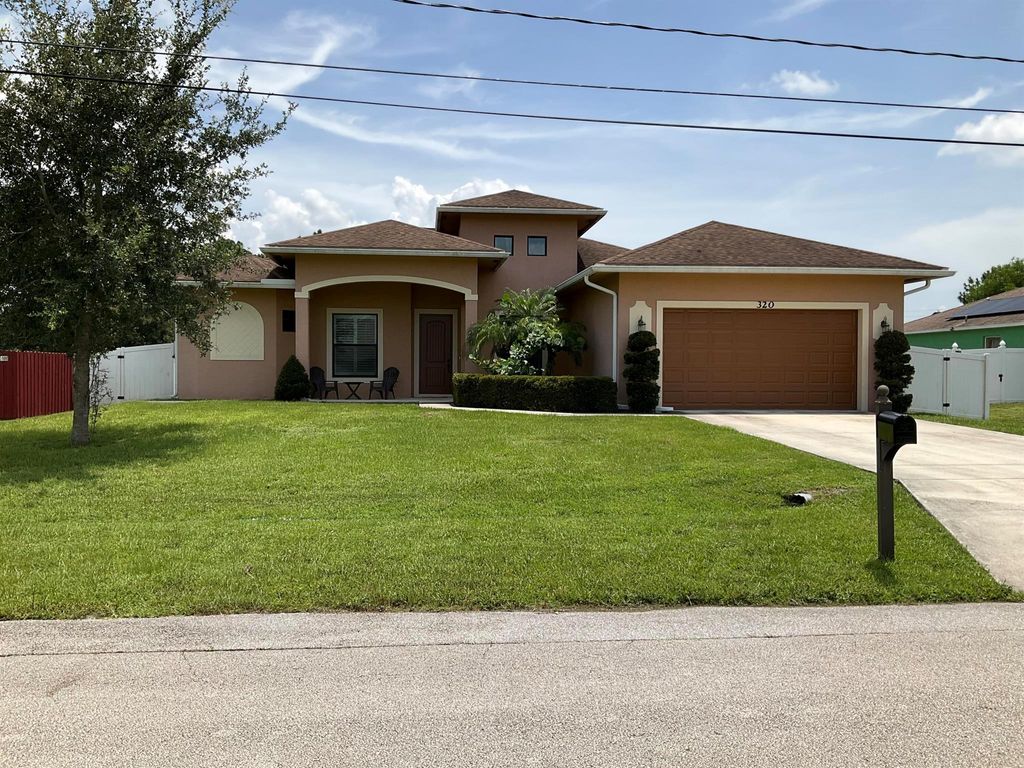 Photo of 320 SW Fig Avenue, Port St Lucie, FL 34953 (MLS # R10906837)
