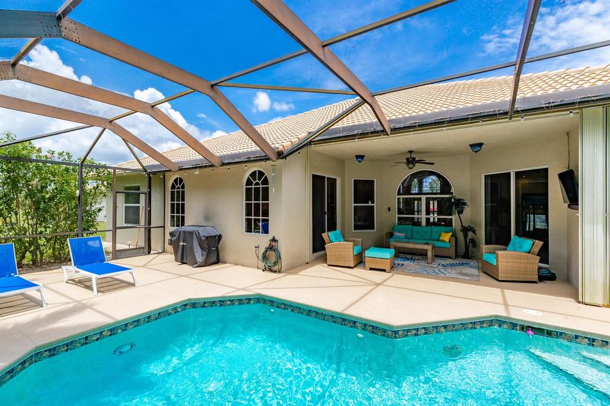 $7,000 in lender credit! Near I-95 and the Turnpike, yet tucked away in a peaceful gated community  Welcome to Sawgrass Lakes Move in ready 4 bedroom, 2 bath home with everything you've been looking for a brand-new kitchen, sparkling pool with spa, and an oversized lot in one of PSL's most desirable neighborhoods.The kitchen showcases custom sage green cabinetry, quartz countertops, a farmhouse sink, and sleek white glass appliances Vaulted ceilings and open, light-filled living areas offer multiple spaces for entertaining.Step outside to your own resort-style oasis: a screened-in pool and spa surrounded by ample deck space and lush tropical landscaping for ultimate privacy.The primary suite features direct pool access, a tray ceiling, and a spa-inspired bathroom.