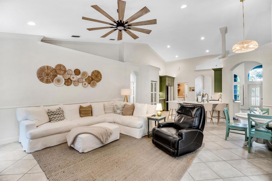 $7,000 in lender credit! Near I-95 and the Turnpike, yet tucked away in a peaceful gated community  Welcome to Sawgrass Lakes Move in ready 4 bedroom, 2 bath home with everything you've been looking for a brand-new kitchen, sparkling pool with spa, and an oversized lot in one of PSL's most desirable neighborhoods.The kitchen showcases custom sage green cabinetry, quartz countertops, a farmhouse sink, and sleek white glass appliances Vaulted ceilings and open, light-filled living areas offer multiple spaces for entertaining.Step outside to your own resort-style oasis: a screened-in pool and spa surrounded by ample deck space and lush tropical landscaping for ultimate privacy.The primary suite features direct pool access, a tray ceiling, and a spa-inspired bathroom.