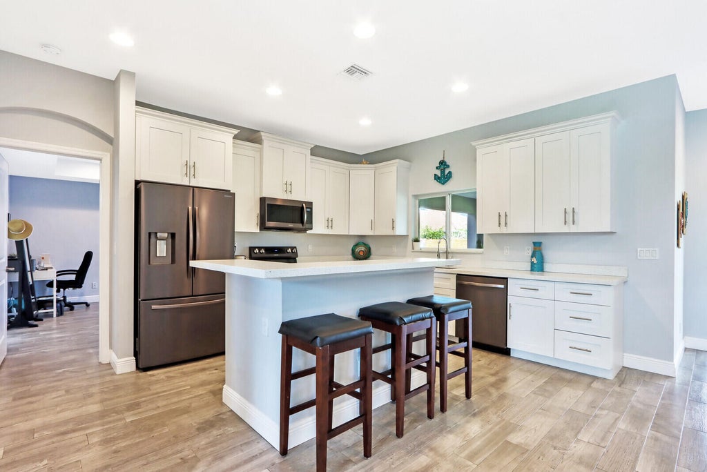 Photo of 5413 NW Bolin Street, Port Saint Lucie, FL 34986 (MLS # R10801892)
