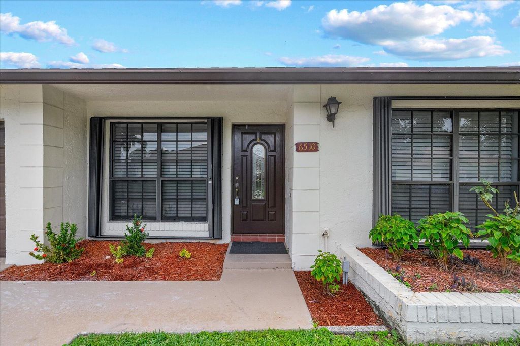 Photo of 6510 Olivewood Circle, Greenacres, FL 33463 (MLS # B26029941)
