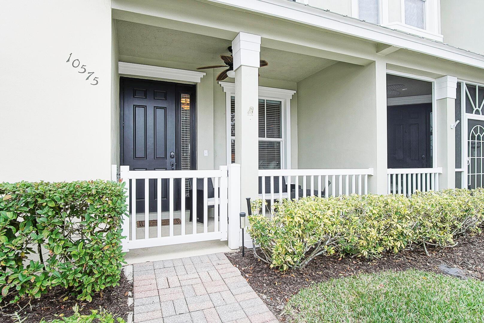 If you're looking for meticulously clean, close to loads of great amenities, and the most affordable way to own in Tradition, this is it! This one-level townhome is conveniently located directly across the street from a dog park, and a couple blocks away from the Bedford Park clubhouse with oversized community pool, a playground, a huge green area with beautfiul mature oak trees, and a serene butterfly park. Outside, you'll love the metal roof, gutters, and spacious two car garage. Step inside, and you'll appreciate the open, split-bedroom layout, tile flooring in the main, and gorgeous new LVT flooring in the bedrooms. Vaulted ceilings add to the space, and the kitchen is adorned with granite countertops, a stylish backsplack, matching stainless steel appliances, and an expansive pantry.