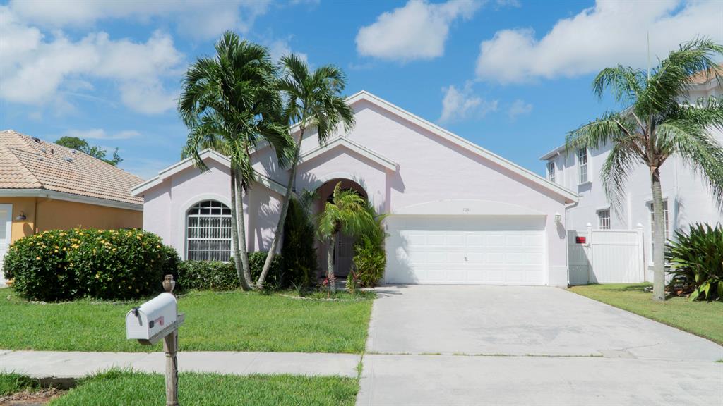 Well maintained 3 bedroom 2 bathroom *split floor plan home. Large Kitchen that is open to dining area. *Master bedroom has walk in closet. The large master bathroom features, *dual sinks, *separate shower and *Large bath tub. *LAUNDRY ROOM INSIDE! *High vaulted ceilings and large open living area. This home also features a *2 car garage and a large driveway. The sliding doors lead out onto the *screened in patio with a separate paved open patio, perfect for BBQing on those nice summer nights. Large *FENCED in backyard with fruit trees for your enjoyment. Centrally located in Wellington, A rated schools. Minutes from WEF! Close to shops, restaurants and the Wellington Green Mall.