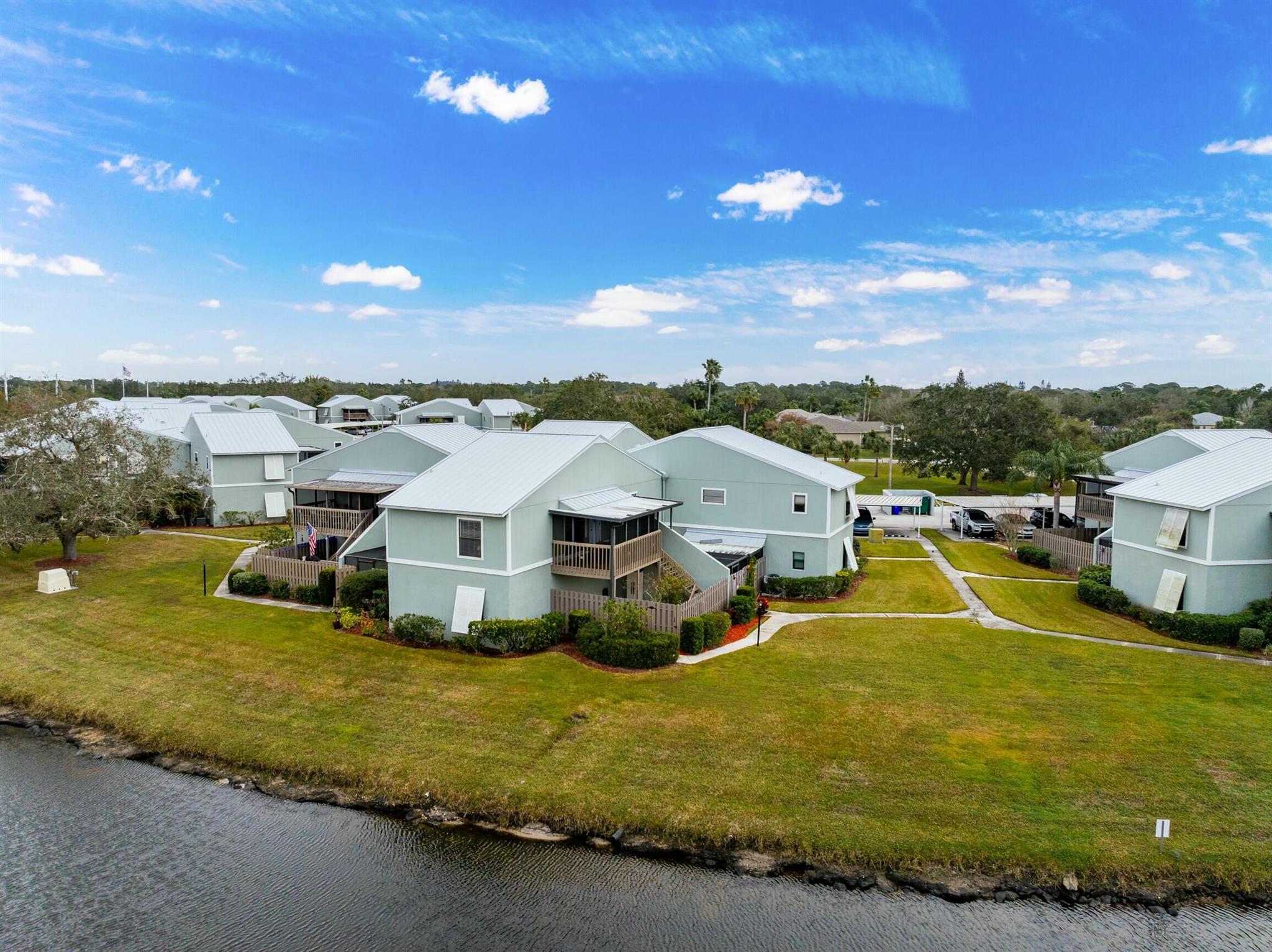 Renovated, partially furnished Second story 2/2 condo overlooking the lake with a screened in balcony upstairs and fenced in, covered patio downstairs. Wood laminate flooring throughout residence with a recently renovated kitchen, freshly painted interior, exterior, & deck with bathroom upgrades. Building has a newer Metal roof with assigned carport parking, and is set to impress. Conveniently located less than 10 minutes from I-95, seconds from Conservation trails/parks/kayak launch, being less than 20 mins from riverfront dining, boat ramps and the gorgeous beaches. Featuring great amenities and one of the largest community pools in Sebastian.