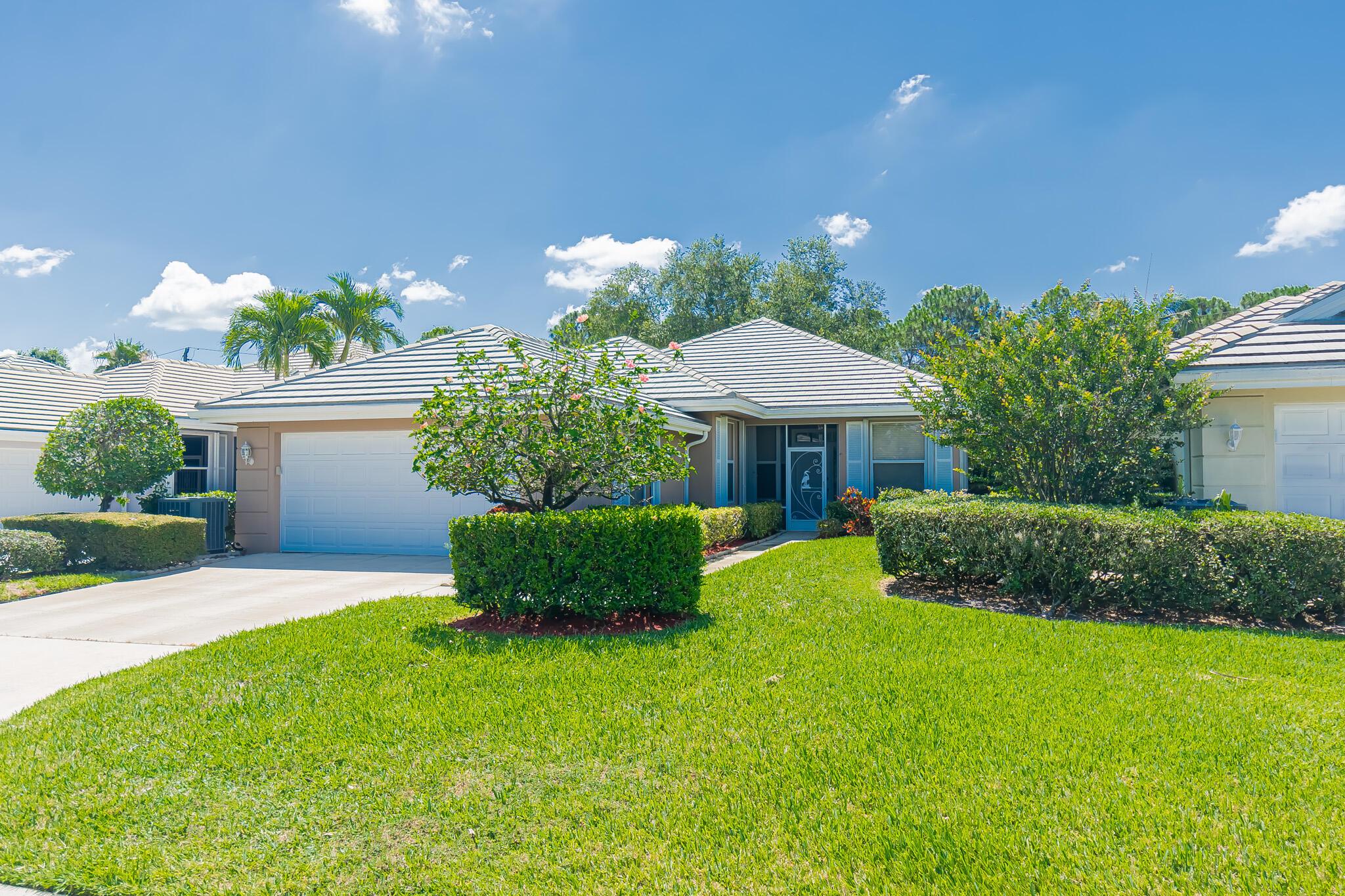 Lakes at St Lucie West! This stylish 3-bedroom, 2-bath home shines with tile floors throughout and an open, inviting layout. Sold built Divosta poured concrete with tile roof. The gourmet kitchen boasts gleaming granite counters, 42'' wood cabinets, stainless steel appliances, and a cozy breakfast nook perfect for morning coffee. Retreat to the spacious living areas or step outside to your private backyard oasis--fenced with lush, tropical landscaping. The expansive covered and screened lanai offers the ideal setting for entertaining, dining al fresco, or simply relaxing year-round. Modern finishes, a warm ambiance, and a prime location make this home a true gem. Accordion shutters, HOA dues provide lawn care, cable, community pools. Convenient to all St Lucie West has to offer.
