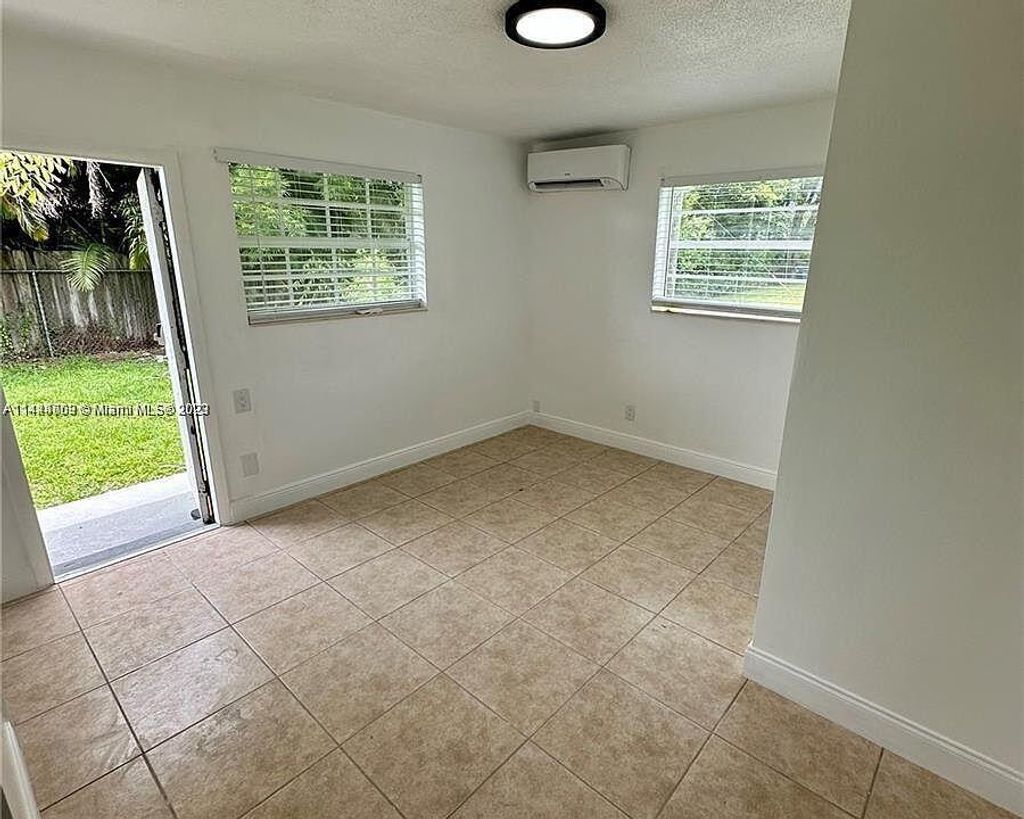 Photo of 810 NW 40th Street #1-3, Oakland Park, FL 33309 (MLS # B26006519)