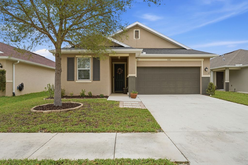 Photo of 5150 NW Pine Trail Circle, Port Saint Lucie, FL 34983 (MLS # B26004472)