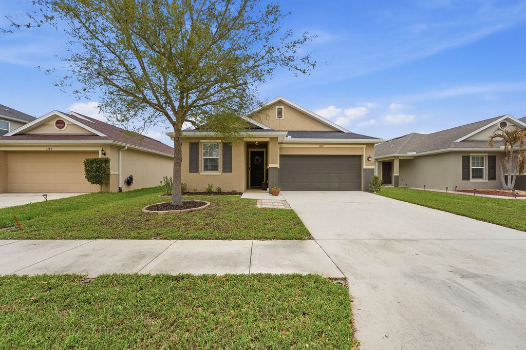Photo of 5150 NW Pine Trail Circle, Port Saint Lucie, FL 34983 (MLS # B26004472)