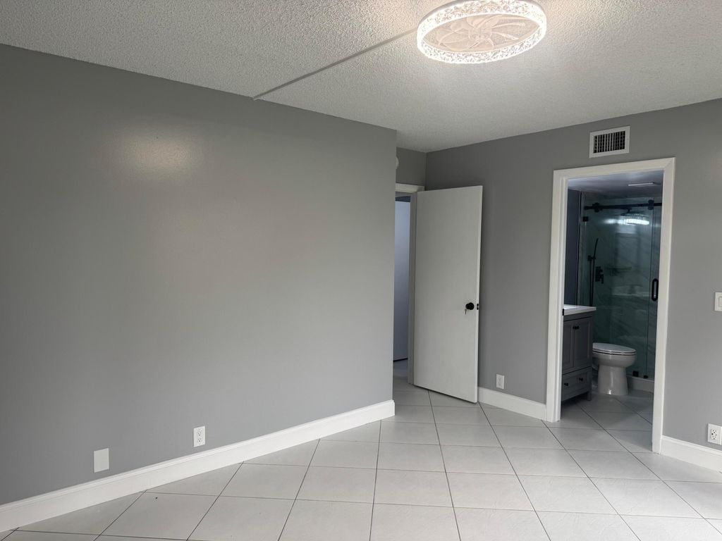 Photo of 802 Sky Pine Way #D1, Greenacres, FL 33415 (MLS # B26013180)