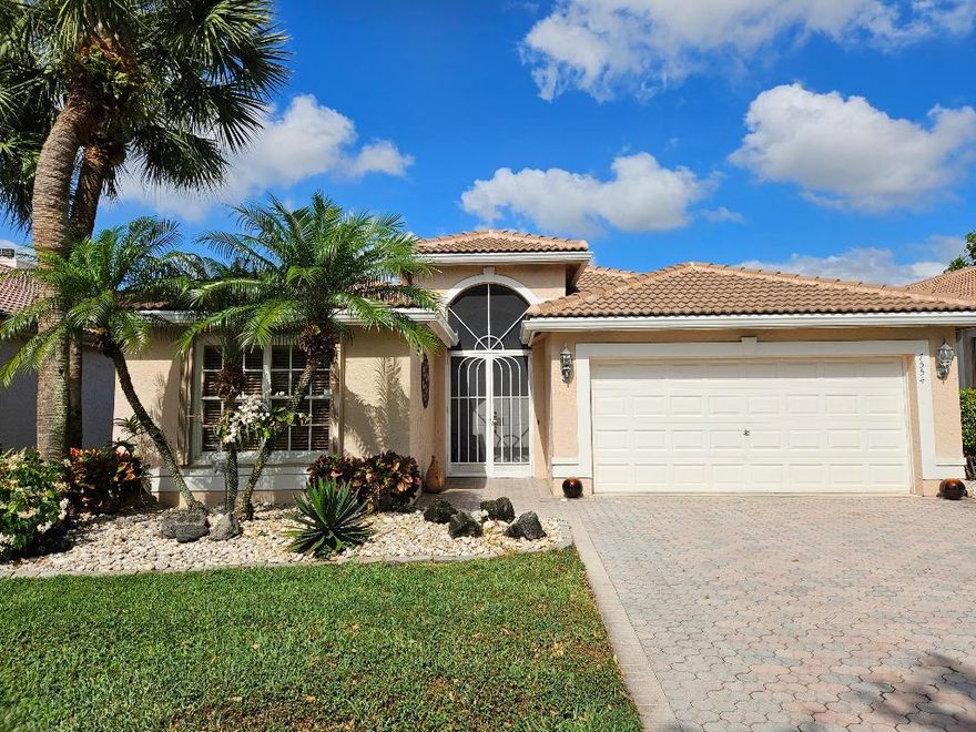 This spacious and airy home has it all!  NEW ROOF.  Gorgeous LONG LAKE VIEW. Sparkling POOL. New stainless steel kitchen appliances and updated raised panel white  cabinetry. Granite counters and tumblestone backsplash. Accordion shutters. Desirable split bedroom plan with Great Room.  Come see it and fall in love.  Active gated adult community with major clubhouse renovation underway, indoor/outdoor cafe, and meandering paths and lakes throughout. An impeccably maintained home in a wonderful lifestyle community!