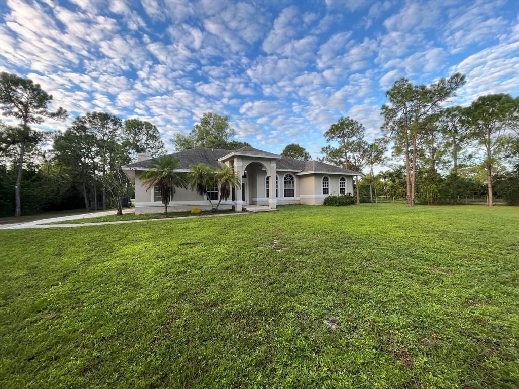 Photo of 18710 93rd Road N, Loxahatchee, FL 33470 (MLS # R10836082)