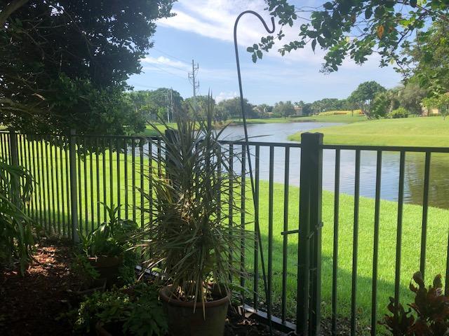 Sit on the covered lanai of this 2 bedroom, 2.5 bath townhome and marvel at the Thompson River below as well as the BallenIsles golf course. Located in PGA Commons on a quiet street within walking distance to restaurants, Earth Fare Market and many shoppes. Freshly painted and new carpeting in upstairs bedrooms. The Turnpike and I-95 are only minutes away. Spacious kitchen has granite counter tops, under cabinet lighting, pantry and washer/dryer. One car garage.