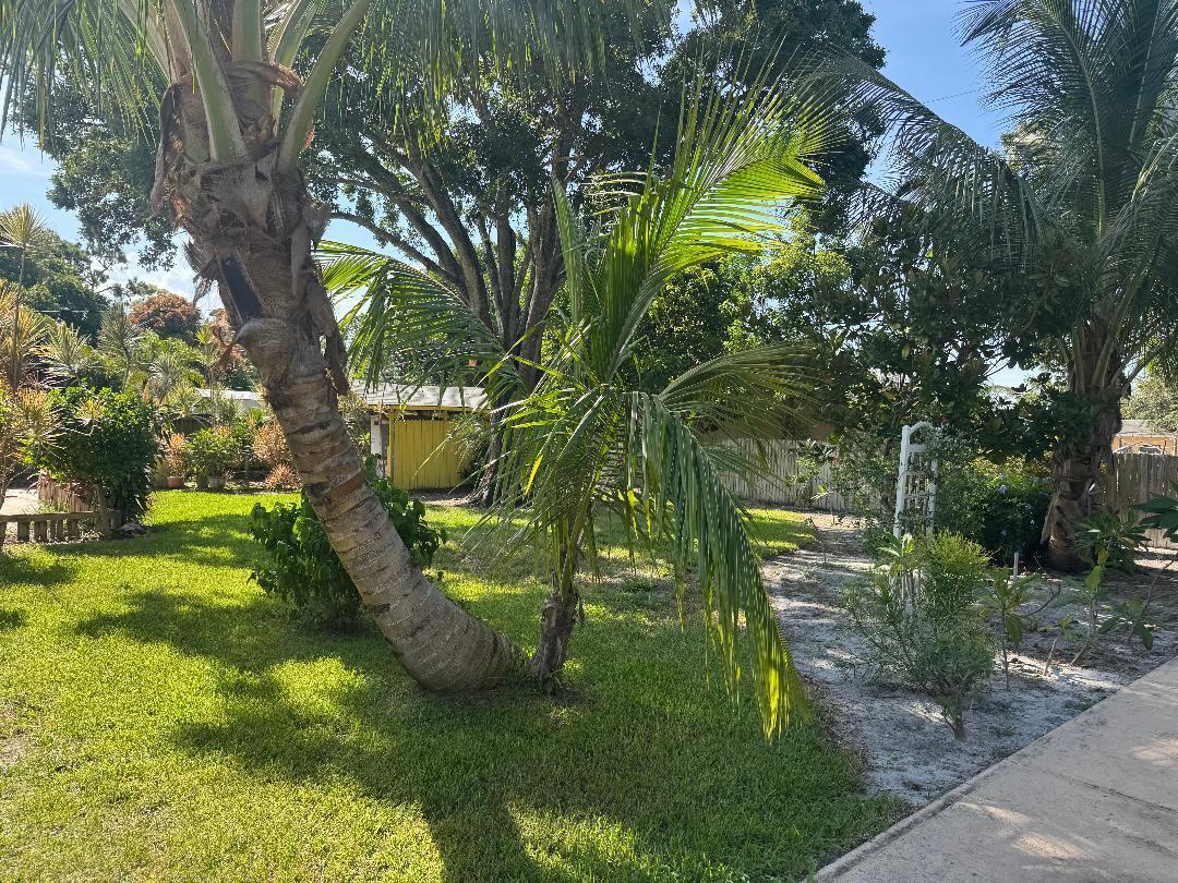 This unique slice of traditional South Florida living could be yours! This ranch style home features a beautifully landscaped house with an amazing paved outdoor grill/entertainment area, a pole barn, a shed, three driveways, slab parking for a boat/RV, and a spacious living area that features 4 bedrooms and a large bonus room. Schedule your private showing today.