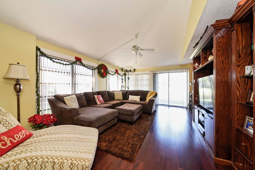 Beautifully updated corner lakefront home.  The home boast real wood floors, new a/c unit, garage, dual sink bathroom, and offers lake views from the master bedroom as well as living area.  Although listed as a 1/1 this home offers a private den/office with a closet that is currently used as a second bedroom.  The kitchen has granite counters, stainless steel appliances.  Laundry is in the back of the one car garage.  This home is ready for you, schedule your showing today.