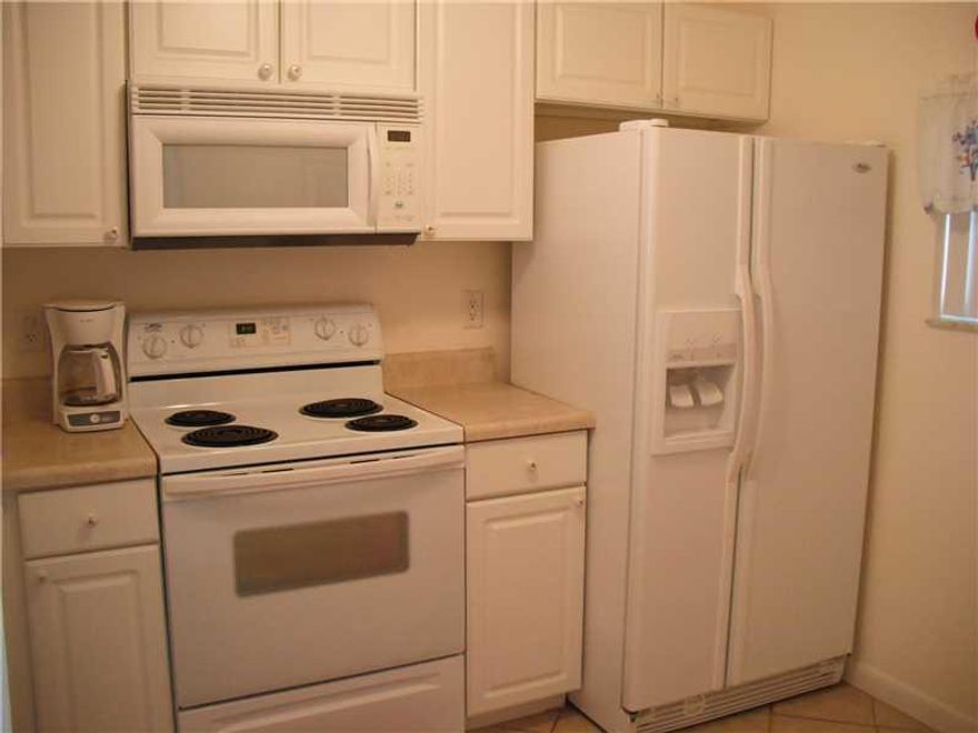 East of Federal furnished condo on 2nd floor. nicely maintained. View of beautiful blue, heated pool for those chilly mornings from your screened balcony. Boat dockage avail for <23' boat. Very nice complex, small, friendly, not a rental community. Ground s and buildings are very well-kept. You will be proud to call this home. No pets please, no smoking in unit. Limited parking. Quick assoc approval. Must lease for a full yr and unit is furnished. No washer/dryer in unit, laundry room on same floor. coin-