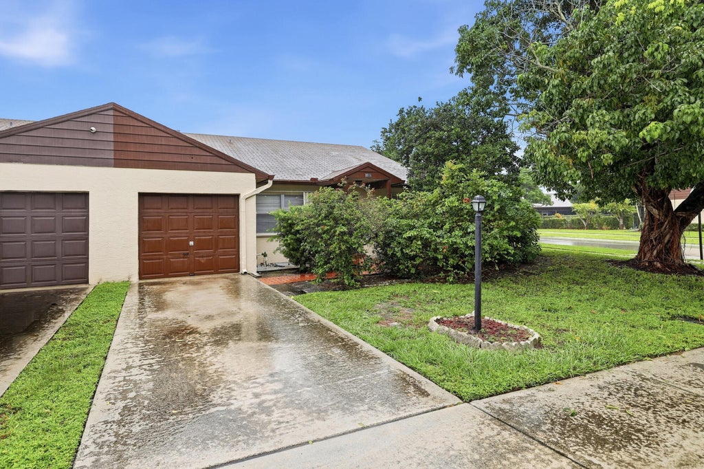 Photo of 8501 BLUE CYPRESS Drive, Lake Worth, FL 33467 (MLS # B26083529)