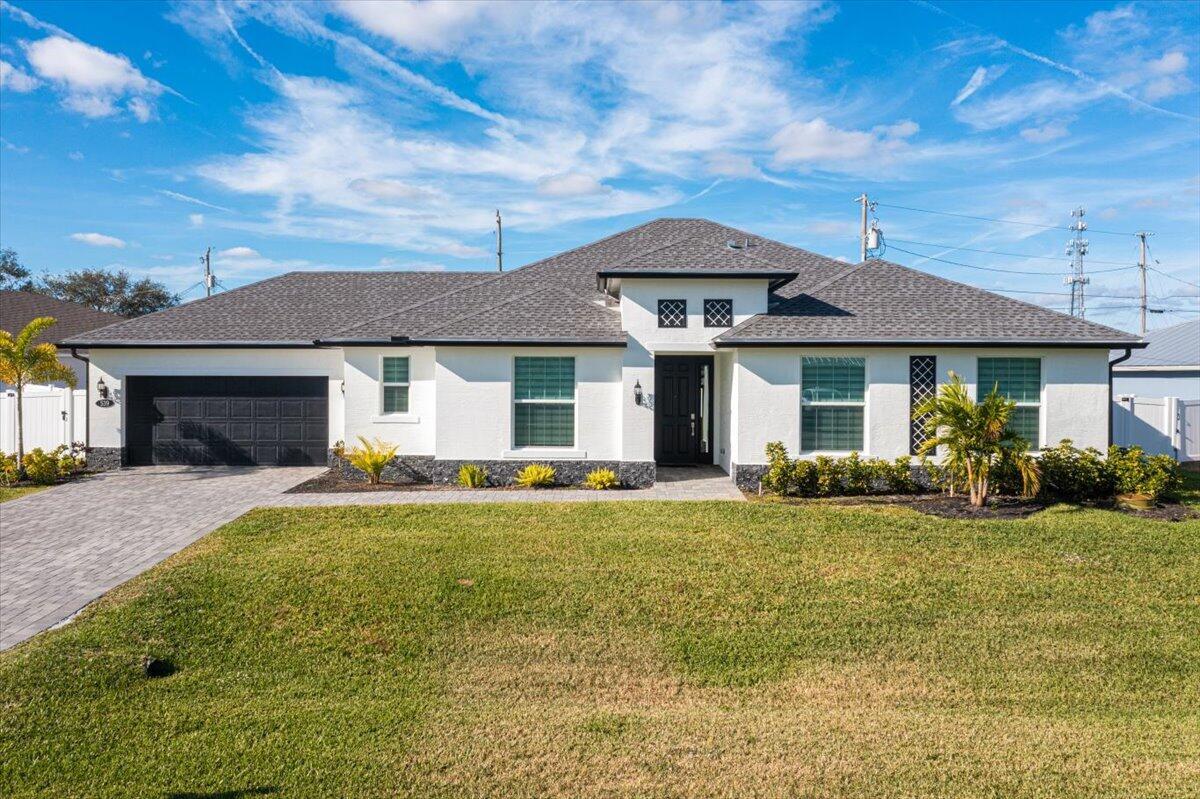 Modern 4-Bed, 3-Bath Home with No HOA!Step into this spacious open-concept home featuring high ceilings, tall doors, and tile floors throughout. The primary suite includes his-and-her walk-in closets, and the living area offers an electric fireplace for cozy nights. The chef's kitchen shines with 42'' soft-close cabinets, quartz and granite counters, a walk-in pantry, and stainless steel appliances. Smart home upgrades include a Nest thermostat, video doorbell, and Schlage Sense lock. Enjoy a fully fenced yard with room for a pool and an automated sprinkler system. Impact-resistant PGT windows add security and energy efficiency. This move in ready home has everything your family needs and is in a great location, about 3 miles from I-95 and around 4 miles from the Turnpike.
