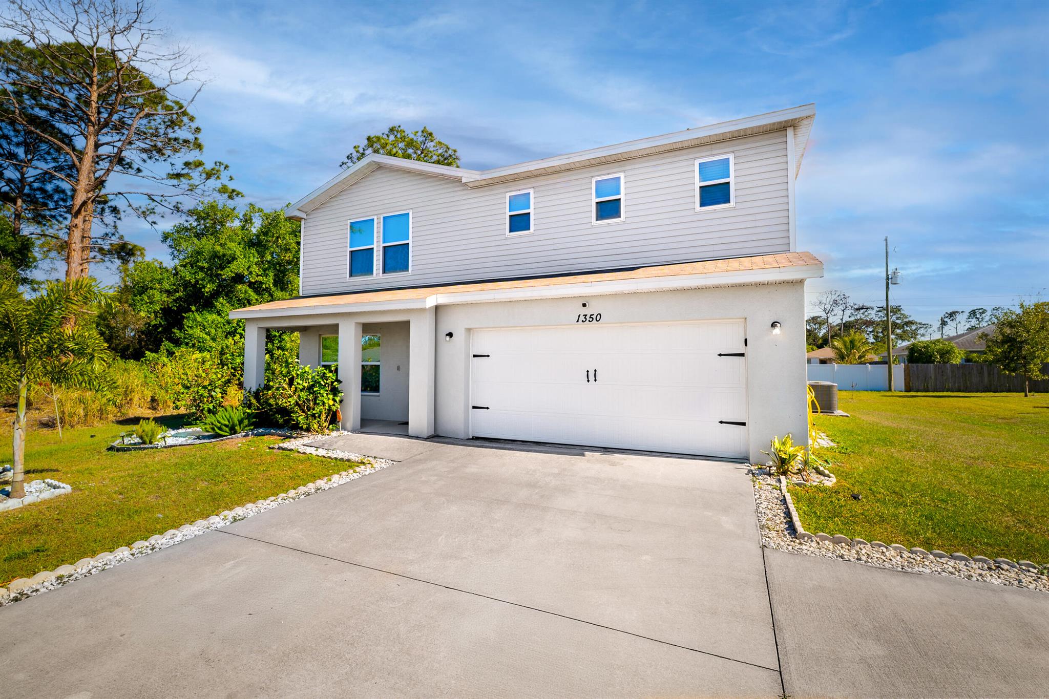 Built in 2021, this beautiful 4 bed, 3 bath, 2-story home in Port St. Lucie offers modern comfort and space for everyone! Features include all new stainless steel appliances, a first-floor bedroom with full bath--perfect for guests or in-laws--and a spacious loft upstairs. The master suite boasts a huge walk-in closet and double vanity, plus two more bedrooms and a full bath. Convenient upstairs laundry with washer and dryer included. Enjoy the oversized backyard with room for a pool--create your dream outdoor oasis! With a 2-car garage and a great location near schools, shopping, and major highways, this home has it all. Schedule your private showing today!
