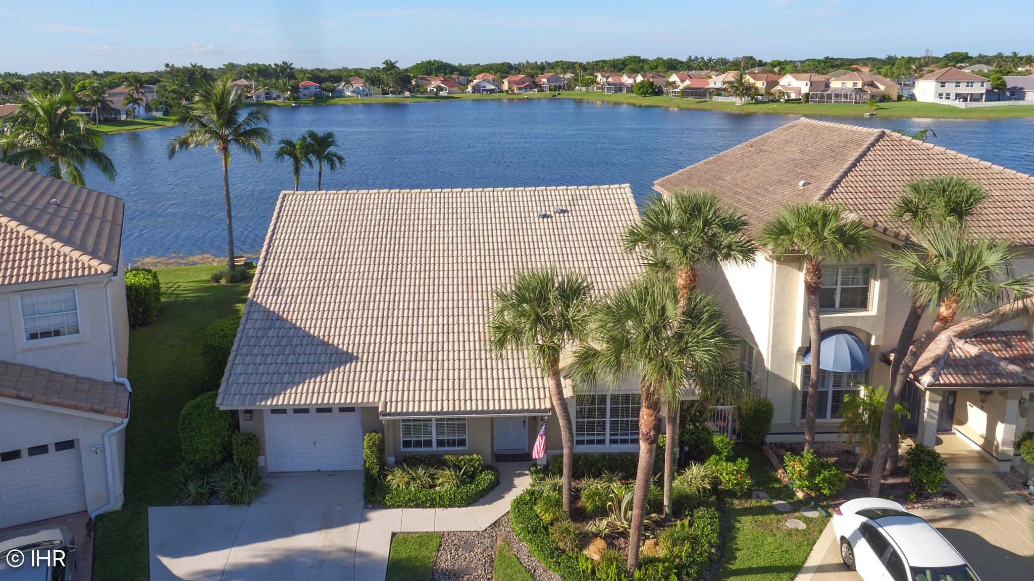 Delight in Florida's endless summer vibes with this 4-bedroom, 2-bath cul-de-sac gem, where year-round sunshine fills the open great room, seamlessly blending a modern kitchen with stainless steel appliances, an elegant dining area and a cozy living space, all framed by stunning pool and lake views-ideal for soaking in warm breezes, vibrant sunsets and the best of outdoor living. Sitting on the peninsula tip, this home boasts panoramic lake views to the east, north, and west, offering a front-row seat to breathtaking sunrises and vibrant sunsets. Plus, the master bedroom features stunning pool and lake views, generous closets, and a spacious bathroom with dual sinks. The other bedrooms are a nice size. The second bath is stylishly designed with a shower-tub. Top-rated schools. Must See!