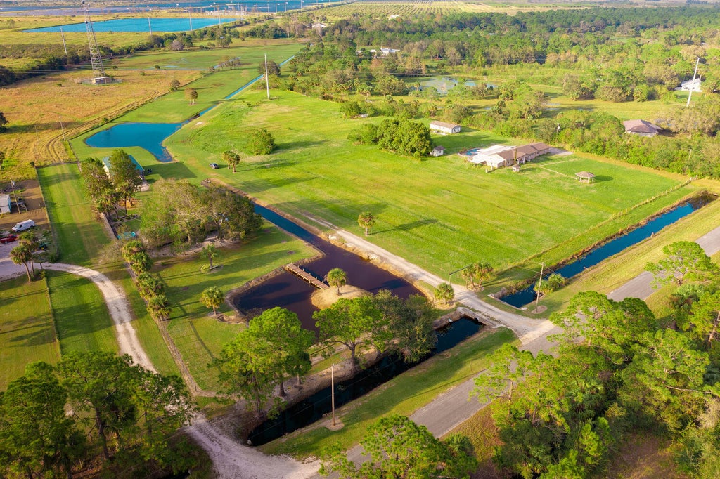 Photo of 21360 Glades Cut Off Road, Port Saint Lucie, FL 34987 (MLS # R10996394)