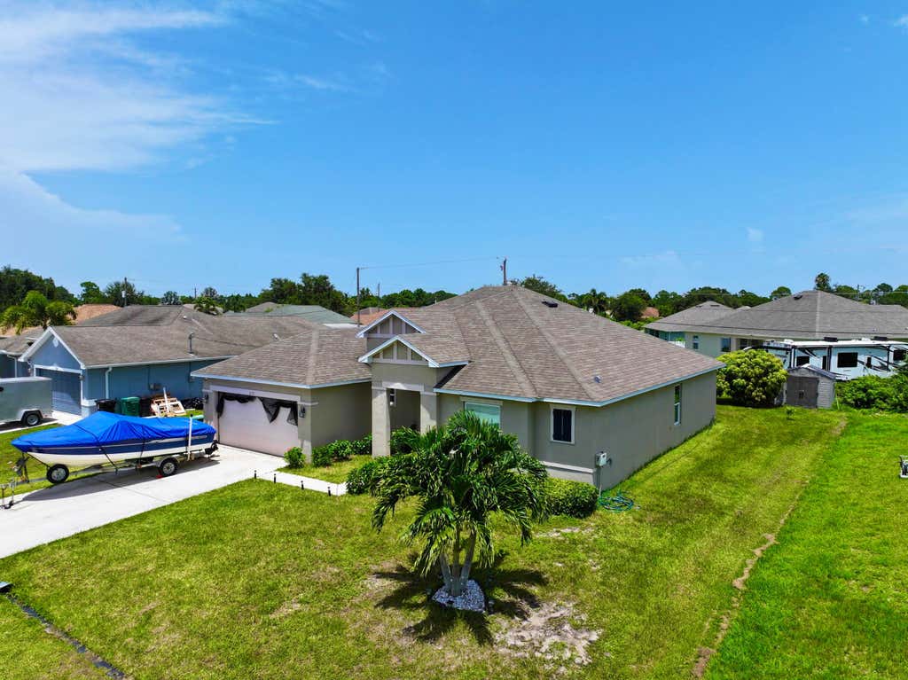 Photo of 3121 SW Hickenlooper Street, Port Saint Lucie, FL 34953 (MLS # R11006166)
